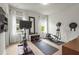 Bright workout room with modern equipment including stationary bike, elliptical trainer, weights and storage at 6306 Anise Dr, Sarasota, FL 34238