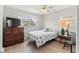 Inviting bedroom with a bed, window, ceiling fan, and dresser at 643 Park Cir, Bradenton, FL 34207