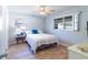 Bright bedroom with a large window, neutral walls, and modern decor at 643 Park Cir, Bradenton, FL 34207
