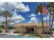 Community clubhouse framed by palm trees with parking at 643 Park Cir, Bradenton, FL 34207