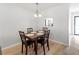 Dining area featuring a view into the kitchen, creating an open and connected living space at 643 Park Cir, Bradenton, FL 34207