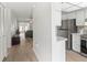 Hallway leading to a living room and open kitchen, providing an airy and connected living space at 643 Park Cir, Bradenton, FL 34207