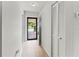 Entry hallway featuring hardwood floors, closet, and a glass front door providing plenty of light at 643 Park Cir, Bradenton, FL 34207