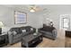 Comfortable living room with stylish furniture, adjacent dining area, and wood-look flooring at 643 Park Cir, Bradenton, FL 34207