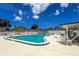 Inviting pool surrounded by lounge chairs and green space, perfect for relaxation at 643 Park Cir, Bradenton, FL 34207