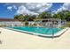 Community swimming pool surrounded by lounge chairs and a covered seating area at 643 Park Cir, Bradenton, FL 34207