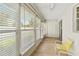 Inviting sunroom with wood floors, ample natural light, and a neutral color scheme at 643 Park Cir, Bradenton, FL 34207