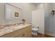 Bathroom featuring granite countertop, tile flooring, and a walk-in shower at 7025 Saddle Creek Cir, Sarasota, FL 34241