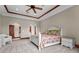 Bright bedroom featuring neutral walls, detailed trim work, stylish ceiling fan, and carpeted floors at 7025 Saddle Creek Cir, Sarasota, FL 34241