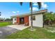 Equestrian building with open doors and seating area at 7025 Saddle Creek Cir, Sarasota, FL 34241