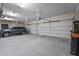 Multi-bay garage featuring epoxy flooring and plenty of room for parking and storage at 7025 Saddle Creek Cir, Sarasota, FL 34241