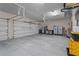Spacious garage with multiple bays, workbench, storage cabinets and a bright interior at 7025 Saddle Creek Cir, Sarasota, FL 34241