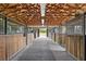 Interior view of horse stalls with wood ceilings at 7025 Saddle Creek Cir, Sarasota, FL 34241