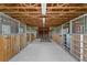 Interior of horse stables featuring wooden stalls and a well-ventilated open design at 7025 Saddle Creek Cir, Sarasota, FL 34241