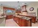 Gourmet kitchen with granite counters and stainless steel appliances at 7025 Saddle Creek Cir, Sarasota, FL 34241