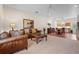 Open concept living room with neutral carpet flooring and comfortable, stylish furnishings at 7025 Saddle Creek Cir, Sarasota, FL 34241