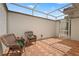 Charming outdoor patio featuring brick flooring and a cozy seating area at 7025 Saddle Creek Cir, Sarasota, FL 34241