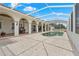Screened in pool and patio area features an arched veranda, ideal for outdoor living and entertaining at 7025 Saddle Creek Cir, Sarasota, FL 34241