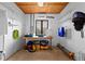 Well-organized tack room with ample storage, shelving, and workbench area at 7025 Saddle Creek Cir, Sarasota, FL 34241