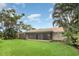 Beautiful backyard with lush landscaping and a screened lanai, offering a private and serene outdoor space at 7401 3Rd Nw Ave, Bradenton, FL 34209