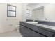 Bathroom featuring a dark cabinet and a shower/tub at 7401 3Rd Nw Ave, Bradenton, FL 34209