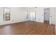 Spacious bedroom with wood-look floors, and large windows for natural light at 7401 3Rd Nw Ave, Bradenton, FL 34209