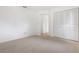 Bedroom with neutral carpet and a double door closet at 7401 3Rd Nw Ave, Bradenton, FL 34209