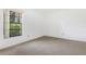 Bedroom featuring neutral carpet and a bright window with green outdoor views at 7401 3Rd Nw Ave, Bradenton, FL 34209