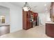 Updated kitchen boasts custom cabinets, stainless steel appliances, and tiled flooring at 7401 3Rd Nw Ave, Bradenton, FL 34209
