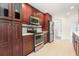 Modern kitchen features stainless steel appliances, custom cabinetry, and tile backsplash at 7401 3Rd Nw Ave, Bradenton, FL 34209