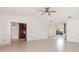 Open-concept living room with tile flooring, dining area, and natural light at 7401 3Rd Nw Ave, Bradenton, FL 34209
