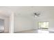 Bright living room with tile flooring, vaulted ceiling, and sliding glass doors at 7401 3Rd Nw Ave, Bradenton, FL 34209