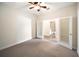 Bedroom featuring neutral carpet and an adjoining bathroom with white doors at 7403 Hamilton Rd, Bradenton, FL 34209