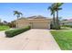Charming villa with attached two-car garage and a well-manicured front yard landscape at 7403 Hamilton Rd, Bradenton, FL 34209