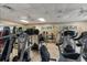Fully equipped community gym with modern exercise machines, ceiling fans and natural light at 7403 Hamilton Rd, Bradenton, FL 34209