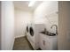 Bright laundry room with modern appliances, sink, and ample storage at 7403 Hamilton Rd, Bradenton, FL 34209
