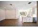 Open living space with a lake view and tile floors adjacent to a modern kitchen at 7403 Hamilton Rd, Bradenton, FL 34209