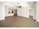 Spacious living room features wood floors, a modern ceiling fan, and an open layout at 7403 Hamilton Rd, Bradenton, FL 34209