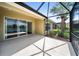 Enclosed patio area providing views of a serene pond and lush landscaping at 7403 Hamilton Rd, Bradenton, FL 34209