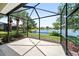 Screened in patio offers scenic views of a pond and the neighborhood at 7403 Hamilton Rd, Bradenton, FL 34209