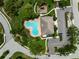 An aerial view shows a community pool, playground, parking area, and tropical landscaping at 7403 Hamilton Rd, Bradenton, FL 34209