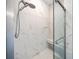 Modern bathroom featuring a luxurious marble shower with a glass door and a convenient built-in seat at 7403 Hamilton Rd, Bradenton, FL 34209