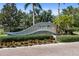 Stone community sign, surrounded by beautiful landscaping, on a brick-paved street at 7403 Hamilton Rd, Bradenton, FL 34209
