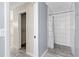Modern bathroom featuring a tiled shower and spacious closet space at 7442 N Leewynn Dr, Sarasota, FL 34240