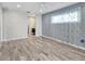 Open bedroom features neutral walls, wood-look flooring and a ceiling fan at 7442 N Leewynn Dr, Sarasota, FL 34240
