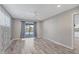 Bright primary bedroom featuring neutral walls, wood-look flooring and sliding glass doors to the pool at 7442 N Leewynn Dr, Sarasota, FL 34240