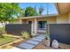 Inviting front yard with stone walkway and modern landscaping enhances the home's curb appeal at 7442 N Leewynn Dr, Sarasota, FL 34240