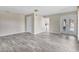 Bright living room featuring neutral walls and French doors leading to the outdoor patio at 7442 N Leewynn Dr, Sarasota, FL 34240