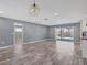Spacious living room with sliding glass doors leading to a private screened-in pool at 7442 N Leewynn Dr, Sarasota, FL 34240