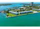 Beautiful aerial view of waterfront condos with boat docks and marina access on Sarasota Bay at 767 John Ringling Blvd # 25, Sarasota, FL 34236